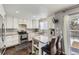 Modern kitchen featuring granite countertops, stainless steel appliances, and breakfast bar seating at 4222 S Himalaya Way, Aurora, CO 80013