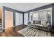 Inviting living room with hardwood floors, a comfortable sofa, and lots of natural light at 4222 S Himalaya Way, Aurora, CO 80013