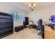Cozy office with large window, carpeted floor, and ample desk space at 4222 S Himalaya Way, Aurora, CO 80013