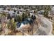 Aerial view of a community pool surrounded by mature trees and well-maintained landscaping at 17 Canon Dr, Greenwood Village, CO 80111