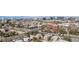 Expansive aerial view capturing the city skyline, neighborhood, mature trees and surrounding landscape at 17 Canon Dr, Greenwood Village, CO 80111