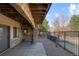 Under deck stone patio and fenced yard at 17 Canon Dr, Greenwood Village, CO 80111