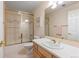 Neutral bathroom features a shower over bath combination, tiled walls and vanity at 17 Canon Dr, Greenwood Village, CO 80111