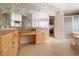 Bathroom featuring dual sinks, tile flooring, ample cabinet space, and a separate shower and tub at 17 Canon Dr, Greenwood Village, CO 80111