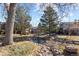 Picturesque community featuring a calming water feature with mature trees and well-maintained landscaping at 17 Canon Dr, Greenwood Village, CO 80111