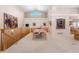 Open-concept dining room with staircase, high ceilings, large windows, and view of the living room at 17 Canon Dr, Greenwood Village, CO 80111