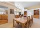 Open-concept dining room with view to the kitchen and view to the spacious living room at 17 Canon Dr, Greenwood Village, CO 80111