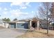 Charming single-story home featuring a two-car garage, stone accents, and well-maintained landscaping at 17 Canon Dr, Greenwood Village, CO 80111