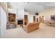 Spacious living room featuring a cozy fireplace, built-in bookshelves, and lots of natural light at 17 Canon Dr, Greenwood Village, CO 80111