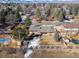 Aerial view of a single-Gathering home with a pool, shed, fenced yard and mountain view at 4192 S Vrain St, Denver, CO 80236