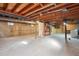 Unfinished basement with exposed ceiling and concrete flooring, ready for customization and ample storage at 4192 S Vrain St, Denver, CO 80236