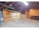 Unfinished basement with exposed beams, concrete walls and floors at 4192 S Vrain St, Denver, CO 80236