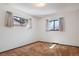 Bedroom featuring two windows with curtains, and neutral paint at 4192 S Vrain St, Denver, CO 80236