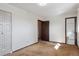 A bright bedroom featuring carpet, closet with doors, and neutral paint at 4192 S Vrain St, Denver, CO 80236