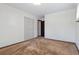 A bright bedroom featuring carpet, closet with doors, and neutral paint at 4192 S Vrain St, Denver, CO 80236