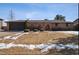 Charming single-story brick home with an arched entryway and manicured front yard at 4192 S Vrain St, Denver, CO 80236