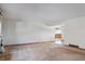 Spacious, neutrally decorated living room displaying the seamless open floor plan and natural light at 4192 S Vrain St, Denver, CO 80236