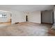 Bright and airy living room showcasing the open floor plan and the view of the kitchen at 4192 S Vrain St, Denver, CO 80236