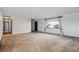 Spacious living room with neutral carpet, bright natural light, and a view of the front yard at 4192 S Vrain St, Denver, CO 80236