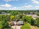 Aerial view of a residential neighborhood with tree-lined streets and well-manicured lawns at 7350 W 21St Ave, Lakewood, CO 80214