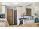 Updated kitchen with stainless steel appliances, marble countertops and wooden barn door at 7350 W 21St Ave, Lakewood, CO 80214