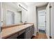 Bathroom with long vanity, cabinets and walk-in shower at 7705 W 87Th Dr, Arvada, CO 80005