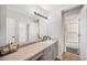 Bathroom featuring a vanity, a mirror, and a shower over tub at 7705 W 87Th Dr, Arvada, CO 80005