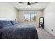 Bedroom with a view of large window and a ceiling fan at 7705 W 87Th Dr, Arvada, CO 80005