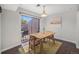 Cozy dining room with modern furniture and natural light, adjacent to an outdoor patio for seamless indoor-outdoor living at 7705 W 87Th Dr, Arvada, CO 80005
