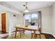 Bright dining room with view of outdoor patio area at 7705 W 87Th Dr, Arvada, CO 80005