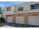 Townhome garages made of brick at 7705 W 87Th Dr, Arvada, CO 80005