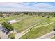 Aerial view of the golf course and driving range for residents to enjoy at 7705 W 87Th Dr, Arvada, CO 80005
