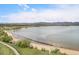 Scenic view of a large lake and mountains providing beautiful scenery near the property at 7705 W 87Th Dr, Arvada, CO 80005