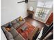 Open living room with a high ceiling, fireplace and a large window at 7705 W 87Th Dr, Arvada, CO 80005