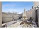 Private patio with outdoor seating and a charming umbrella, perfect for relaxing at 7705 W 87Th Dr, Arvada, CO 80005