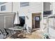 Cozy patio with outdoor dining set, privacy fence, and access to the home's entrance at 7705 W 87Th Dr, Arvada, CO 80005