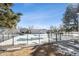 Community pool covered for the winter season; view of surrounding fences and association buildings at 7705 W 87Th Dr, Arvada, CO 80005