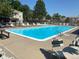 Community pool with lounge chairs, providing a relaxing outdoor space for residents at 7705 W 87Th Dr, Arvada, CO 80005