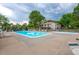 Community pool with lounge chairs under a cloudy sky offering a relaxing outdoor space for residents at 7705 W 87Th Dr, Arvada, CO 80005