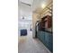 Well-organized walk-in closet with built-in shelving, dresser, and clothing rods leading to carpeted bedroom at 7705 W 87Th Dr, Arvada, CO 80005