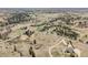Expansive aerial view of a rural landscape with scattered houses, trees, and winding roads at 12160 Spring Creek Rd, Parker, CO 80138