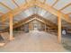 A spacious attic or loft area with exposed beams and ample storage potential at 12160 Spring Creek Rd, Parker, CO 80138