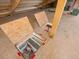 This interior shot features barn's wooden floor with access panels revealing storage or utility space below at 12160 Spring Creek Rd, Parker, CO 80138