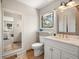 Classic bathroom features a marble countertop and a decorative mirror at 12160 Spring Creek Rd, Parker, CO 80138