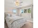 Bright bedroom with large windows, a ceiling fan, and a comfortable bed at 12160 Spring Creek Rd, Parker, CO 80138