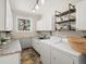 Functional laundry room with modern washer, dryer, and plenty of storage at 12160 Spring Creek Rd, Parker, CO 80138