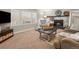 Cozy living room featuring fireplace, comfortable seating, and natural light at 12160 Spring Creek Rd, Parker, CO 80138