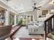 Bright sunroom with skylights, many windows, and cozy seating area at 12160 Spring Creek Rd, Parker, CO 80138
