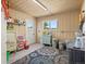 Utility room with neutral walls, a large area rug, storage cabinets, and a utility sink at 12160 Spring Creek Rd, Parker, CO 80138