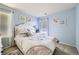 Bright bedroom with a comfortable bed, soft colors, and plenty of natural light at 13626 Garfield St # A, Thornton, CO 80602